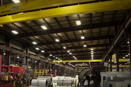 A dimly lit warehouse before LED retrofitting