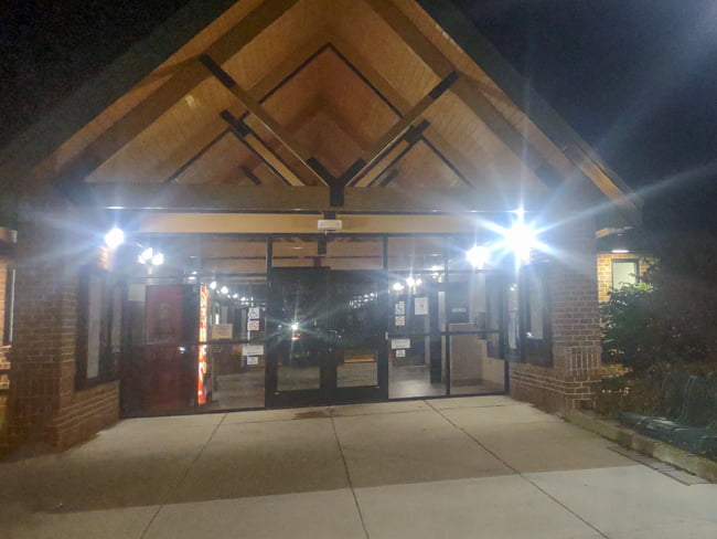 LED wall packs mounted on the entrance of a rest stop area illuminating the area around the door