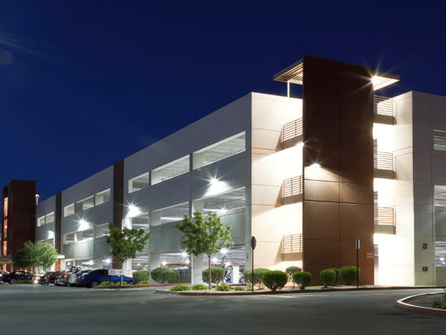 Wide angle shot of a parking Lot structure at night