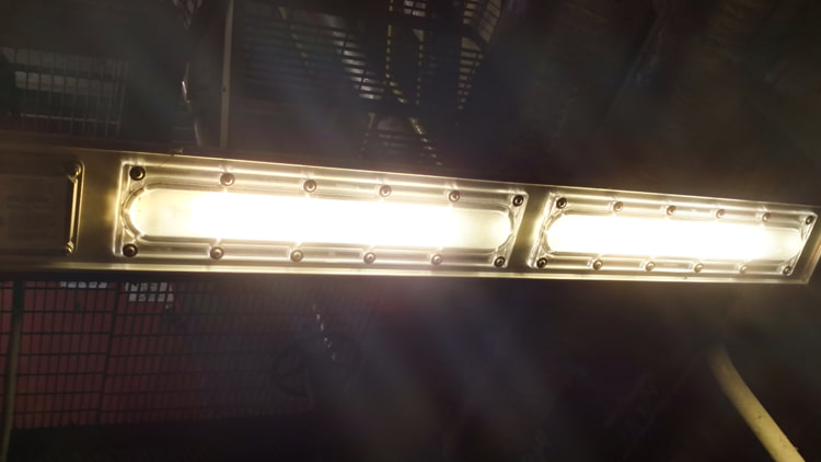 Linear Explosion Proof light hanging from an industrial ceiling
