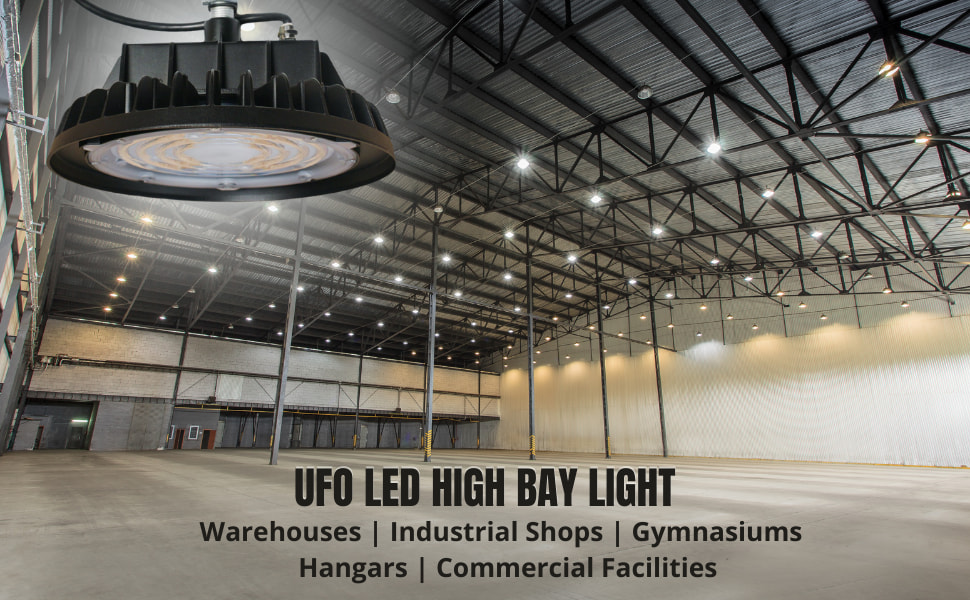 Round shaped UFO LED high bay lighting fixtures illuminating a large hangar from a high ceiling.