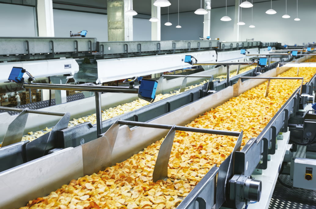 Food production line being illuminated by white food safe lights